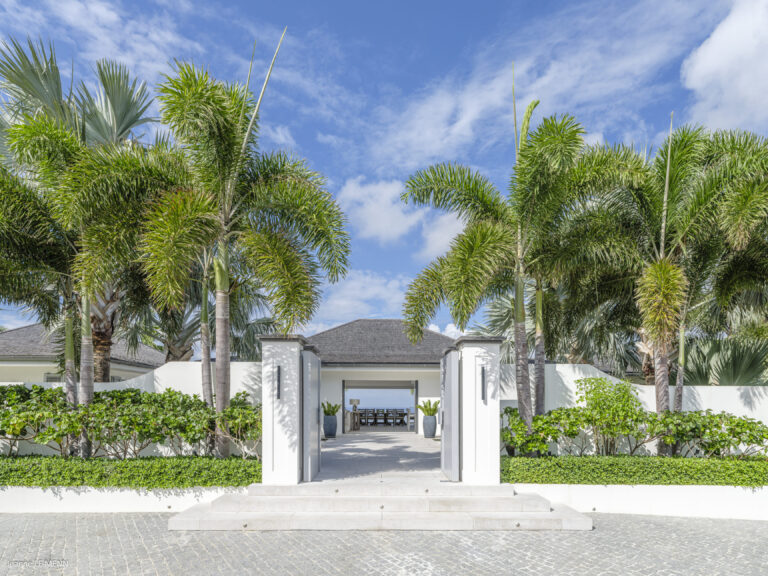 Palm-lined entrance courtyard at Villa Antares, St. Barts.