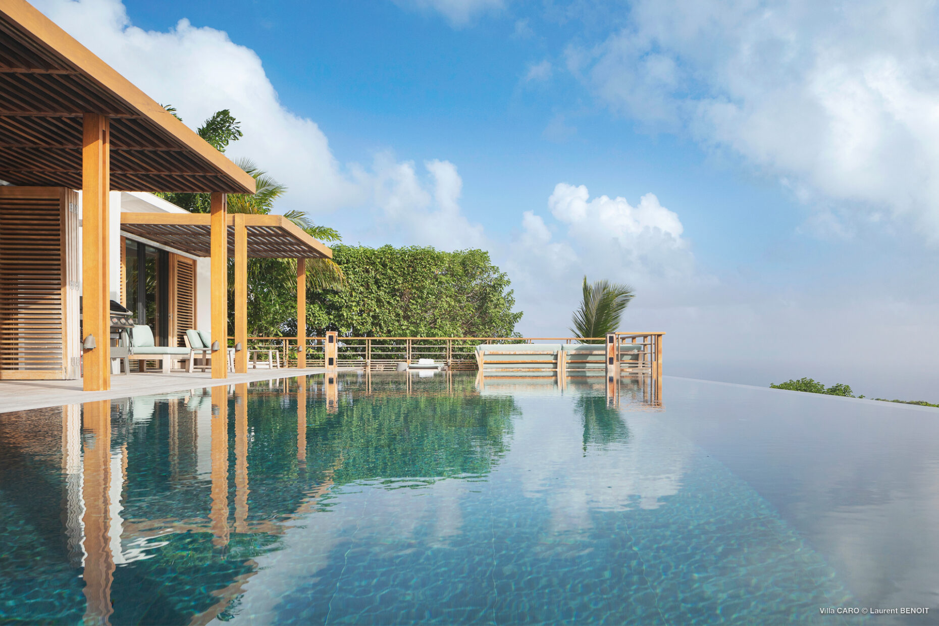 Infinity pool with wraparound terrace and ocean horizon at Villa Caro, St. Barts.