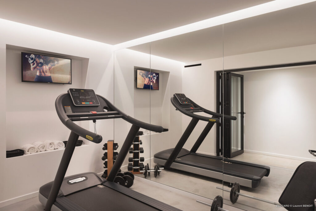 Private fitness room with treadmill and weights at Villa Caro, St. Barts.